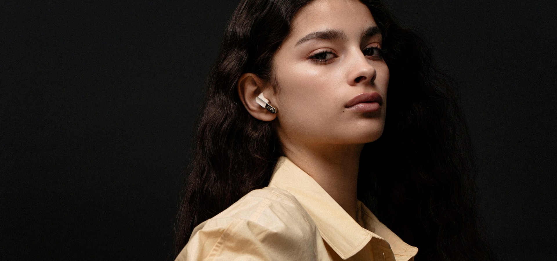 Sudio N3 TWS earbuds on a male model