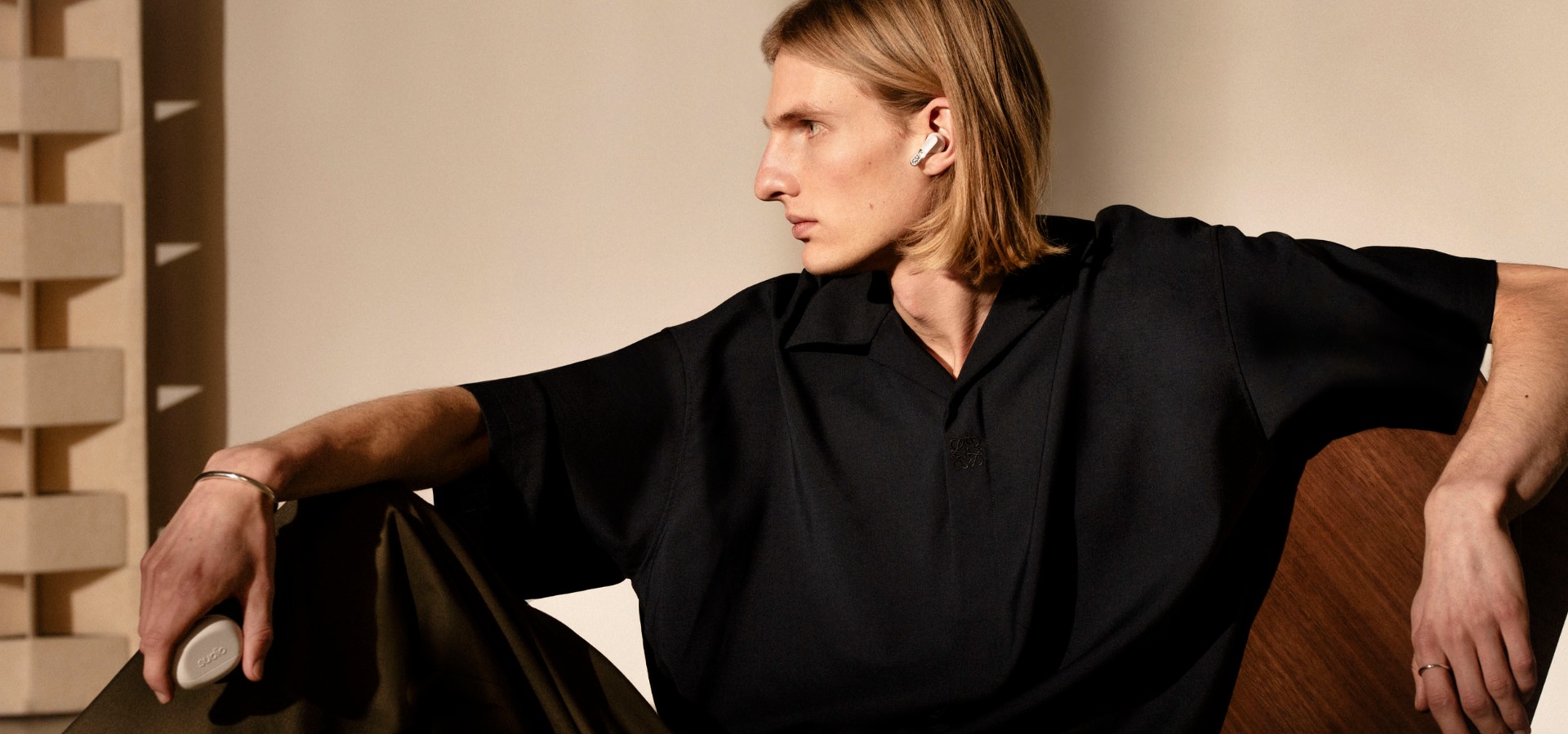 Sudio E3 Black TWS earbuds on a male model