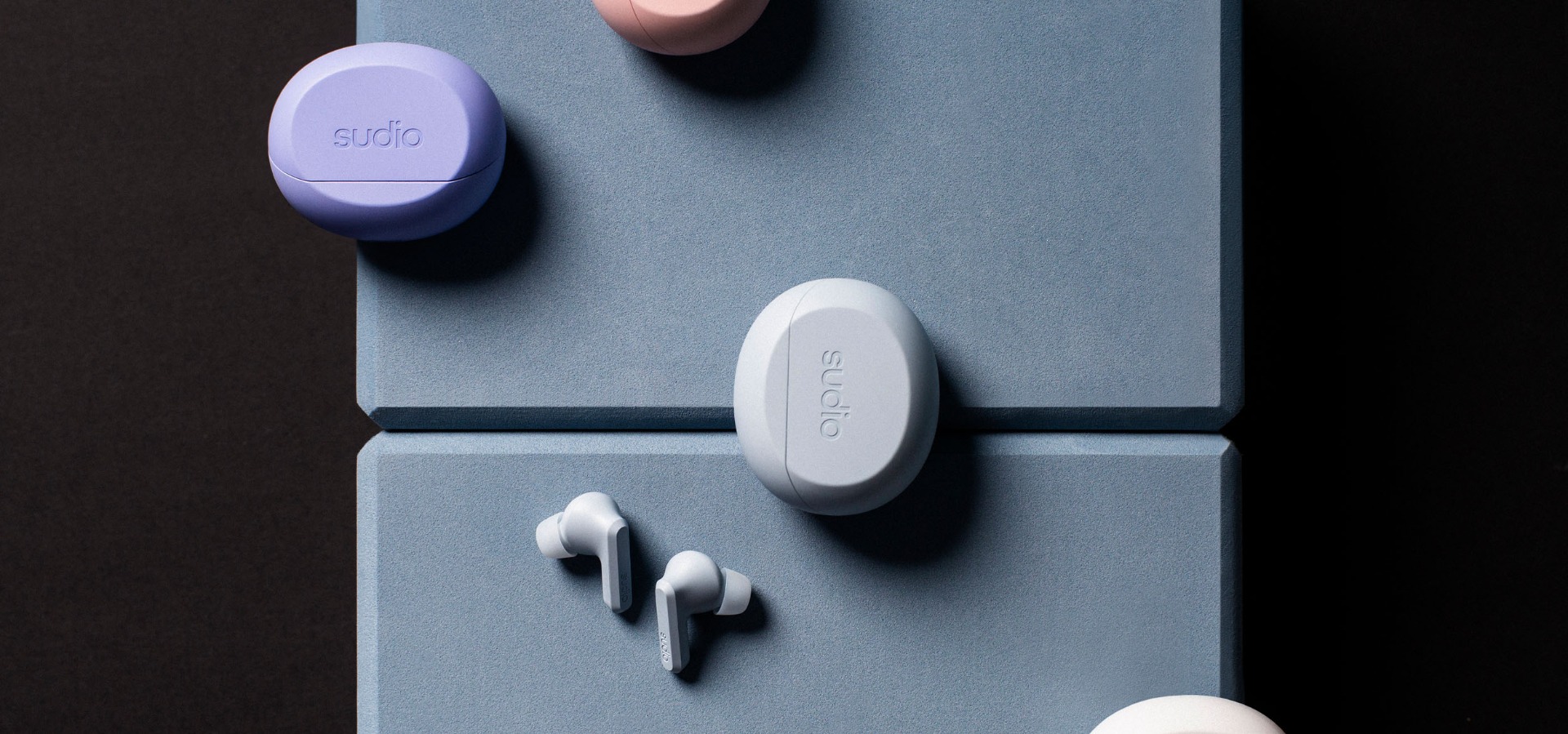 Sudio A3 Pro on earbuds on a model